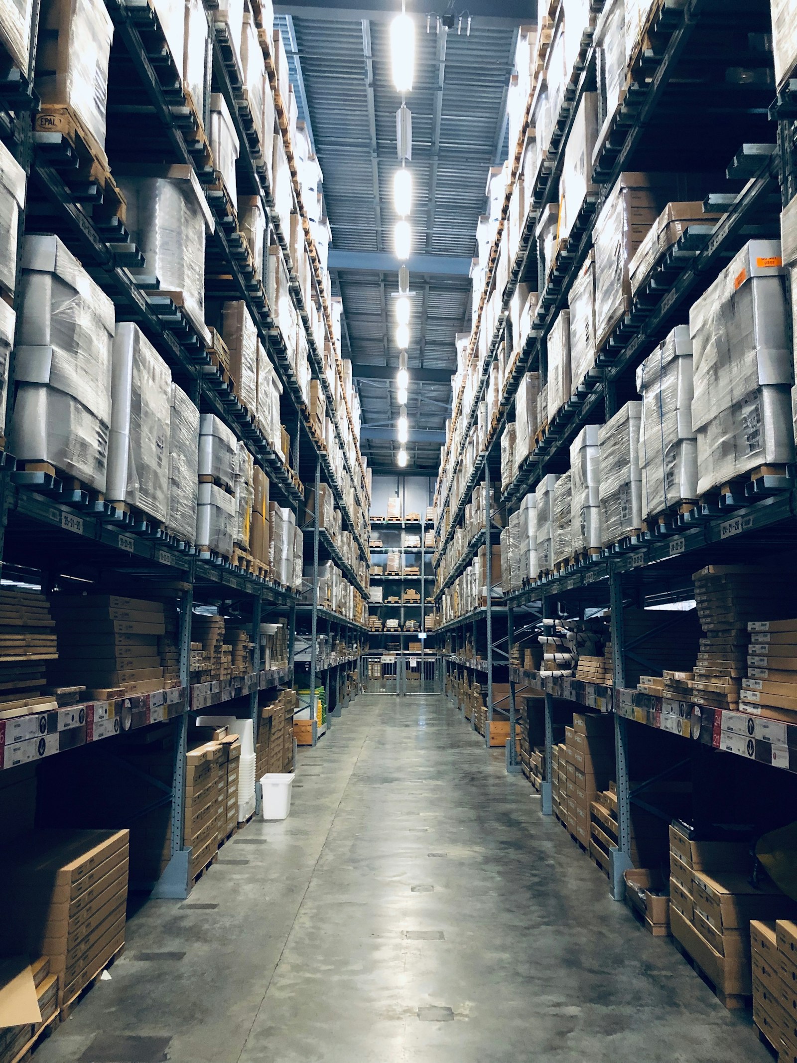 Warehouse aisle filled with pallets